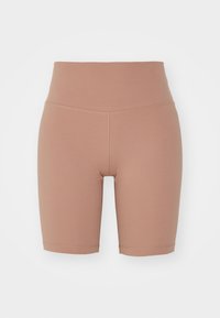 Pantalones cortos de ciclismo de talle alto en un marrón claro, fabricados en un tejido suave y elástico con costuras planas y un diseño ajustado. Sin patrones ni elementos metálicos visibles.