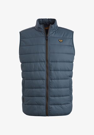 Podložena modra brezrokavnik s stoječim ovratnikom, sprednjim zadrgo in logotipom na levi strani prsnega koša. Tekstura je gladka z quilted ploščami.