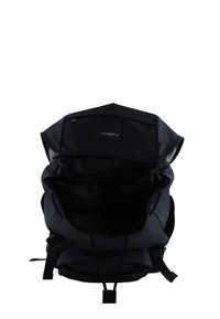 Navy blue backpack made of durable fabric. Features a spacious interior with adjustable straps, a drawstring closure, and a logo tag.