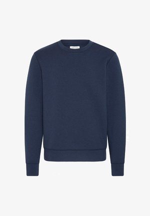 Tumesinine ümmarguse kaelusega spordipusa, millel on pikad varrukad, soonikkoes mansetid ja alläär, vabast stiilist, lihtne disain.