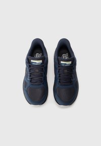 Pair of navy blue Skechers lightweight athletic shoes with black mesh and laces, shown from overhead on a white background.