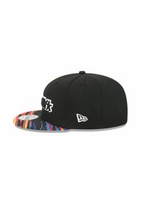 Black cap with a vibrant, patterned brim featuring red, blue, and yellow stripes; front logo in white. Includes side logo detail.