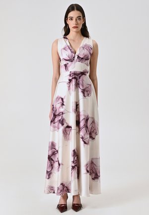 Abito maxi in tessuto crema, con un vivace motivo floreale in viola e borgogna. Scollo a V e vita aderente con una gonna svasata.
