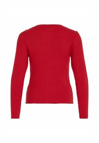 Röd ribbad tröja med långa ärmar och rund halsringning. Har axelknappar som accent och en figurnära design. Strukturerat stickat tyg.