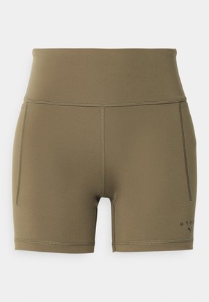 Olive green high-waisted sports shorts made of stretchy material, featuring flat seams and a small logo on the lower side.
