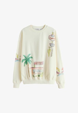 Krēmkrāsas džemperis ar krāsainiem retro motelis, palmu koku, kaktusa un ātrās ēdināšanas zīmes ilustrācijām uz priekškārtas un piedurknēm.