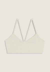 Brassiere off-white, realizzata in tessuto morbido. Caratterizzata da un design a coppa triangolare, spalline sottili e regolabili, e una texture a coste orizzontali sul bordo.