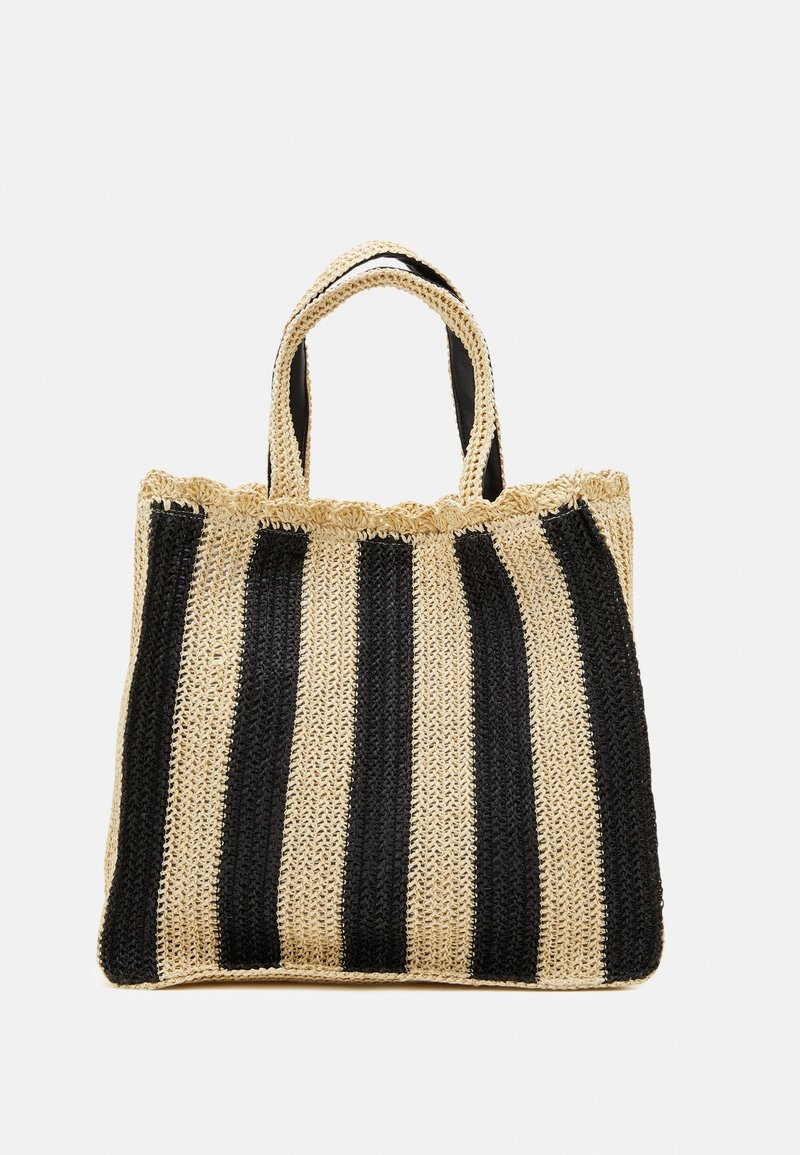 Sac fourre-tout tissé avec des rayures horizontales noires et beige naturel, surface texturée, et deux poignées courtes et robustes.