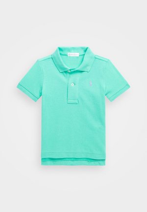 Polo in verde menta, realizzata in cotone texturizzato. Presenta un colletto, una patta con due bottoni e un piccolo logo ricamato a sinistra.