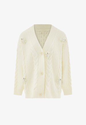 Kardigan vaaleankermanväristä palmikkoneuletta isoilla napilla ja pienillä, etupuolella ja hihoissa olevilla, kiinnitettyillä teddykarhu koristeilla.