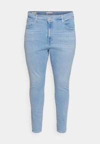Ljust blå skinny jeans gjorda av denim, med en klassisk femficksdesign, bälteslingor och knäppning fram.