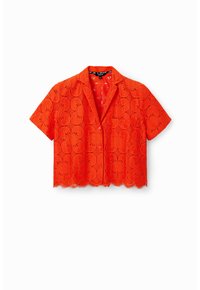 Chemisier court à manches courtes en dentelle orange vif, avec motifs floraux, ourlet festonné et devant boutonné avec col.
