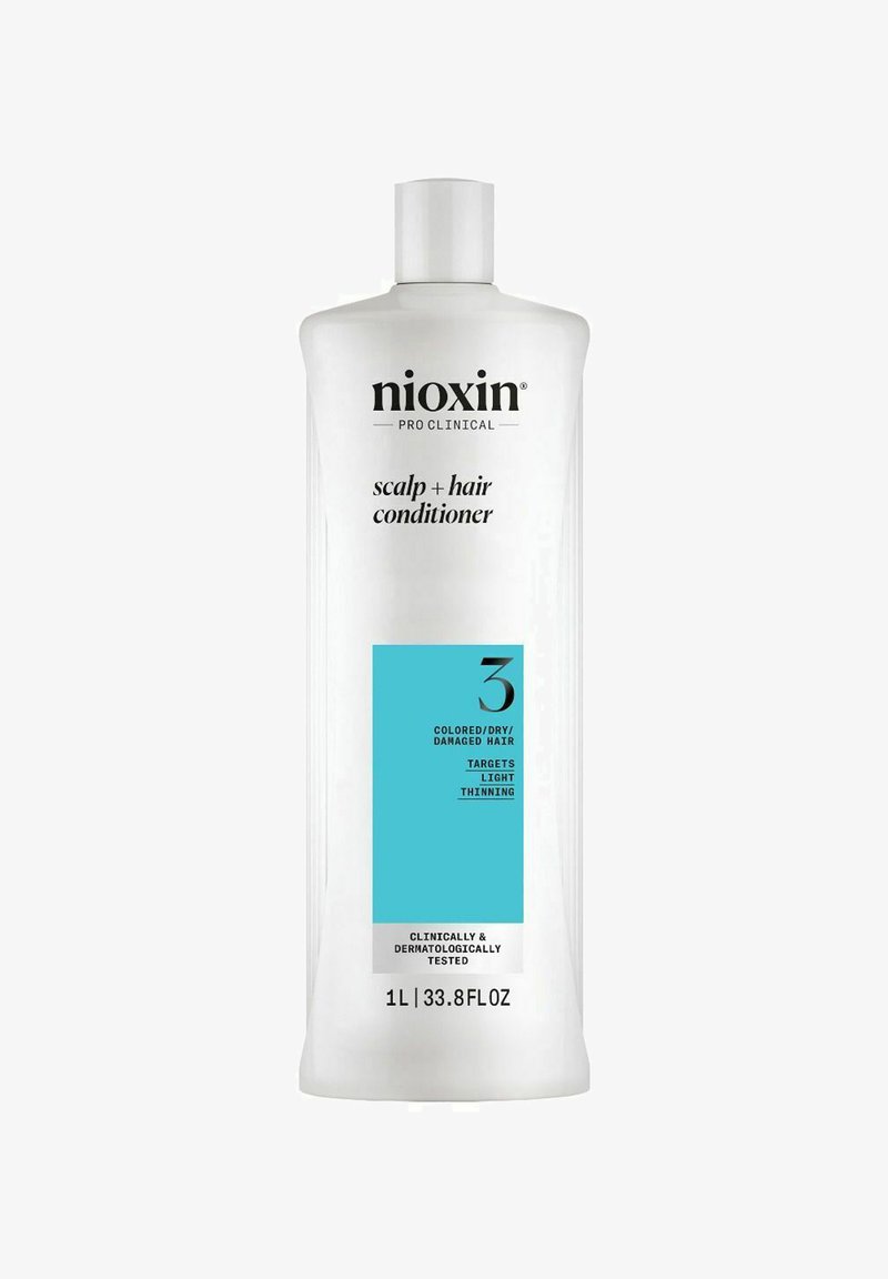 Nioxin Pro Clinical Kopfhaut- und Haarspülung, weißer Flasche, blauer Etikett mit Produktdetails, 1 Liter Kapazität, klinisch getestet.