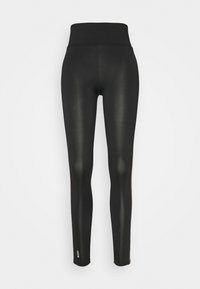 Svarta leggings med hög midja, slät yta och figurnära design. Har dekorativa sidodetaljer och en liten logotyp nära fållen.