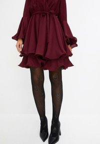bonprix MIT GLITZERDRUCK - Collant - black