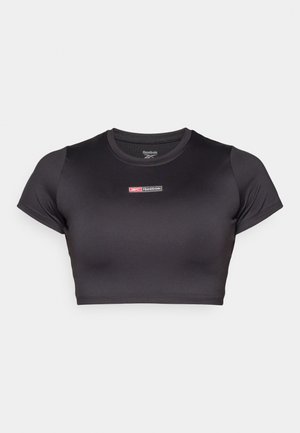 Crni kratki majica od rastezljivog, glatkog materijala, s okruglim izrezom i kratkim rukavima. Ima mali Reebok logo sprijeda.