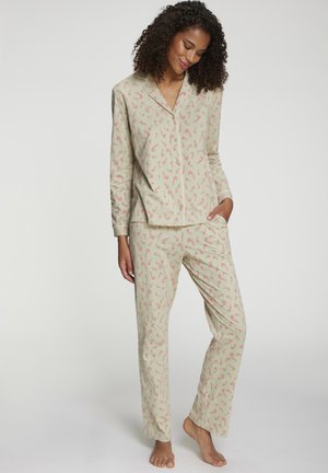 Baumwoll-Pyjama-Set in Hellgrün mit rotem Zuckerstangenmuster. Beinhaltet ein Hemd mit Kragen und Knopfleiste sowie passende Hosen mit elastischem Bund.