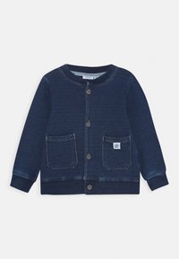 Navy blue knitted cardigan, featuring a round neck, button front, two front pockets, and ribbed cuffs and hem.  Includes a small label on pocket.