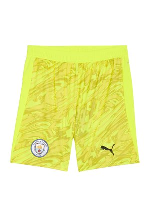 Pantalones cortos del Manchester City en un amarillo brillante con un patrón de remolino dinámico, con una cintura elástica y el logo de Puma en negro.