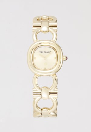 Relógio Ferragamo em tom de ouro com caixa arredondada, design de bracelete ligado e mostrador em tom claro com marcadores de horas e logotipo.