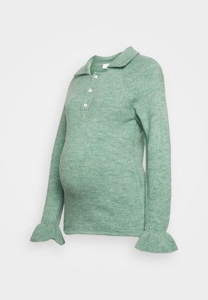 Top de maternidade verde tricotado com gola, três botões decorativos e punhos evasê. Textura suave e design ajustado para conforto.
