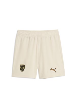 Creamfarvede sports shorts med elastisk talje, et mørkt logo på venstre ben og et lille brunt Puma-logo på højre ben.