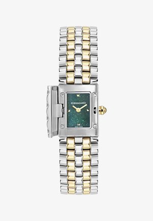 Taisnstūra formas Ferragamo rokas pulkstenis ar zaļu punktētu ciparnīcu, zeltainām rādītājiem, divkrāsainu sudraba un zelta metāla rokassprādzi, kā arī aizsargpārklāju ar eņģēm.