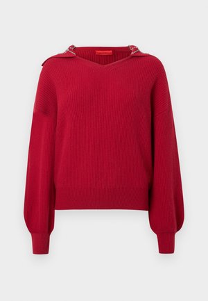 Red ribbed sweater with a v-neck, long sleeves, and a decorative hood. Features a textured knit and subtle detailing on the shoulders.