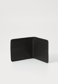 Black wallet made of recycled leather, featuring multiple card slots, a smooth texture, and a subtle green "RECYCLED LEATHER" detail.