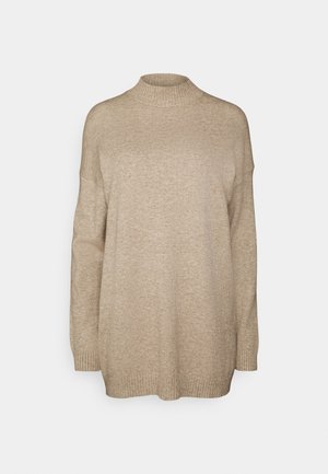 Beige Pullover mit langen Ärmeln und hohem Kragen, aus weichem Strickmaterial gefertigt. Mit überschnittenen Schultern und gerippten Bündchen und Saum.