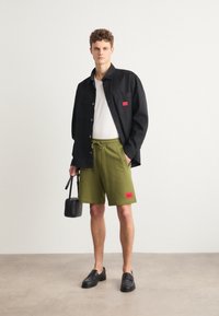 HUGO DIZ - Pantaloni de trening - open green