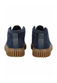 Navy suede shoes with a textured back, featuring a grey textile stripe and a rubber sole with vertical ridges.