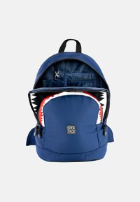 Navy fabric backpack with a shark-themed inner lining. Features zippers, a front pocket, and adjustable straps. Dimensions not specified.