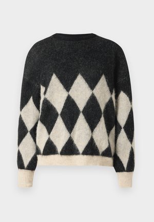 Crni i krem oversized pulover s dijamantnim uzorkom, izrađen od mekog teksturiranog materijala s rebrastim rubom i manžetama.