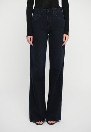Wide-leg dark blue jeans made from denim, featuring front pockets, a button closure, and a smooth texture with stitched detailing.