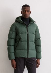 Green puffer jacket with a hood, featuring a front zipper and side pockets. The fabric has a smooth texture with quilted sections.