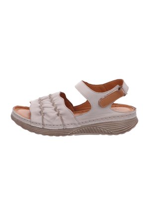 Light beige open-toe sandal with ruched leather front, adjustable ankle strap, cushioned insole, and textured sole for support and comfort.