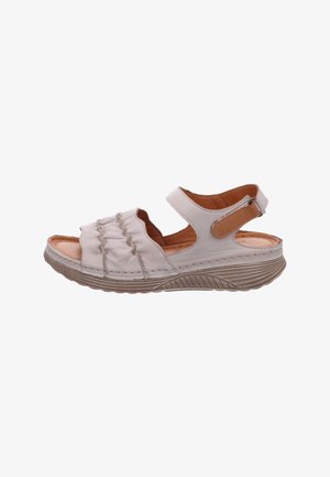 Light beige open-toe sandal with ruched leather front, adjustable ankle strap, cushioned insole, and textured sole for support and comfort.