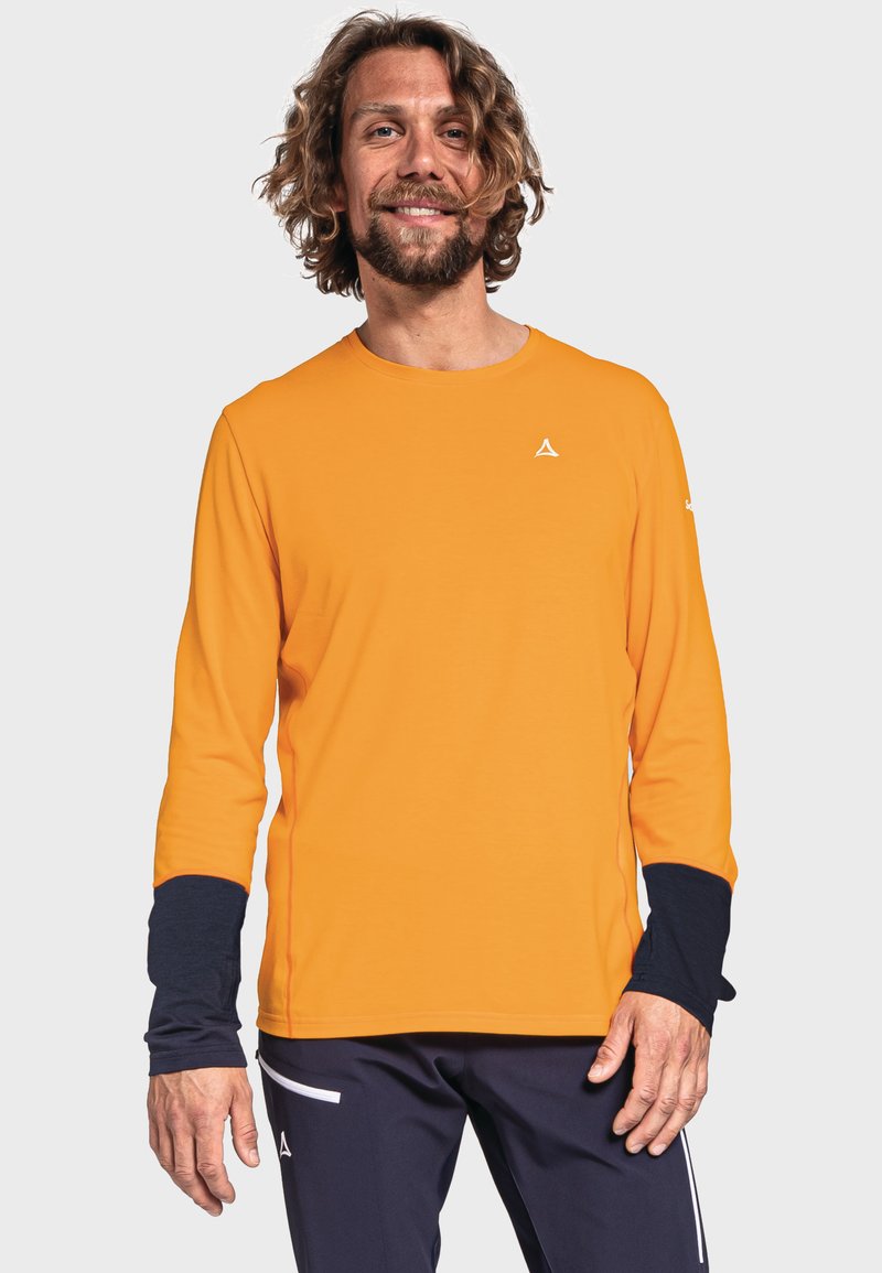 Långärmad träningsskjorta i ljus orange med rund hals, kontrasterande mörkblå manschetter och en liten logotyp på bröstet. Slät textur.