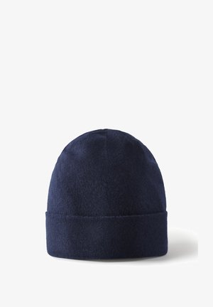 Bonnet en laine bleu marine doux avec un revers plié, présentant une texture lisse et un sommet arrondi. Pas de motifs ou de matériel visible.