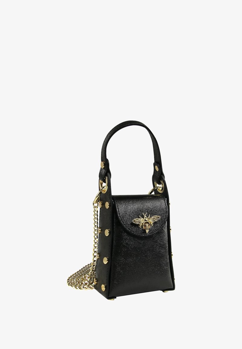 Black leather handbag with a structured design, embellished with gold hardware and a bee motif. Features a chain strap and decorative studs.