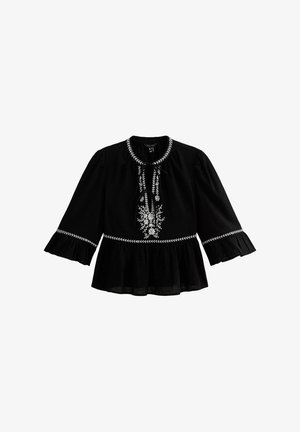 Black blouse with flared sleeves, ruffled hem, and white floral embroidery. Features a tie closure at the neck and a textured fabric.