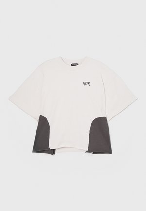 White short-sleeve t-shirt with dark gray side panels, rounded hem, and front logo detailing. Made from cotton blend fabric.