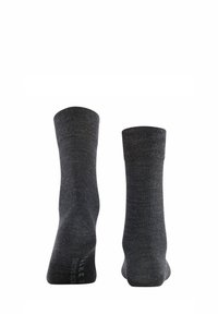 Calzini grigi a girocchi con un motivo a maglia texturizzato, bordo a coste e marchio sul tallone. Realizzati in un materiale morbido ed elastico.