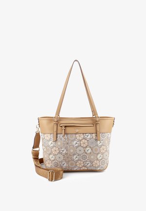 Sac fourre-tout beige et marron clair à motifs géométriques, avec deux bretelles d'épaule et une bande de travers réglable et marquée.