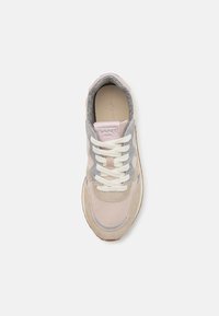 Sneaker featuring a mix of pale pink and grey suede and leather, with white laces and a textured insole. Rounded toe and neutral sole.