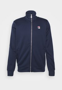 Giacca a zip della Marina con colletto alto, tessuto morbido, tasche laterali, polsini a coste e un piccolo logo multicolore sul petto.