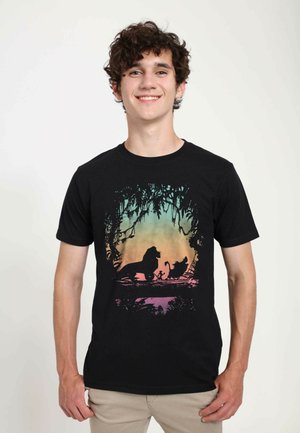 Black cotton t-shirt featuring a silhouette print in gradient colors of a lion and two characters against a jungle background.