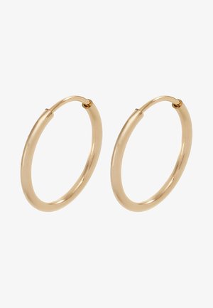 Pendientes de aro de oro con un acabado suave y pulido. Forma redondeada, tamaño mediano, con un mecanismo de cierre seguro.