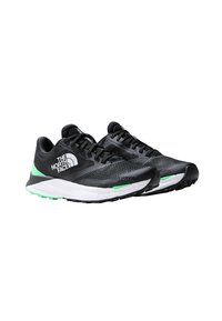 Scarpe sportive nere con parte superiore in rete, dettagli bianchi e verdi, e suola ammortizzata. Presentano un design a motivo e un logo sul lato.